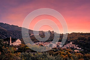 Sunset over mountain villages in Corsica photo