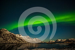 Dramatic polar lights, Aurora borealis over the mountains in the North of Europe - Lofoten islands, Nature of Norway