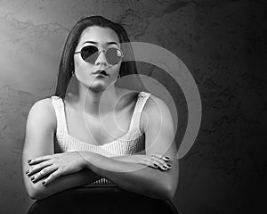 Dramatic portrait of beautiful Pacific Islander woman wearing sunglasses