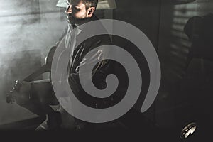 Dramatic portrait of a man playing a guitar. Guitarist