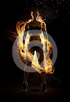 Dramatic portrait of professional bodybuilder. Fire and energy.