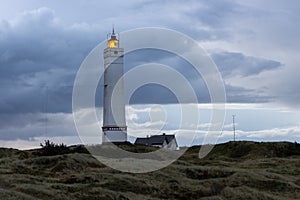 Dramatic predawn sky at lighthouse of Blavand in Denmark