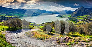 Dramatic rain clouds over lake Rosamarina