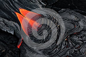 Dramatic red hot molten lava flow photo