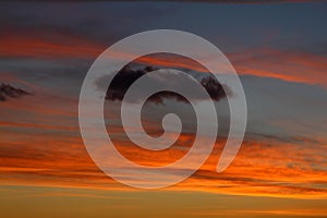 Dramatic red and orange sky and clouds abstract background. Red-orange clouds on sunset sky. Warm weather background.