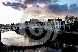 Dramatic scene Dublin night scene with Ha`penny bridge and Liffey river lights