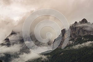 Dramatic scenery in the Dolomite Alps, Italy, in summer, with storm clouds and majestic peaks