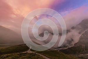 Dramatic scenery in the Dolomite Alps, Italy, in summer, with storm clouds and majestic peaks