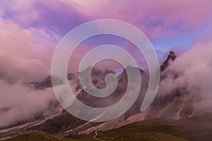 Dramatic scenery in the Dolomite Alps, Italy, in summer, with storm clouds and majestic peaks