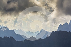 Dramatic scenery in the Dolomite Alps, Italy, in summer, with storm clouds and majestic peaks