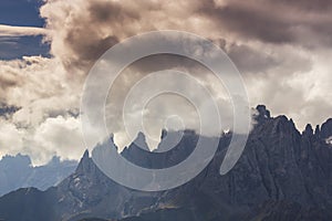 Dramatic scenery in the Dolomite Alps, Italy, in summer, with storm clouds and majestic peaks