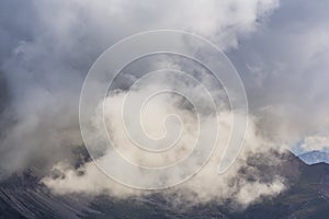 Dramatic scenery in the Dolomite Alps, Italy, in summer, with storm clouds and majestic peaks