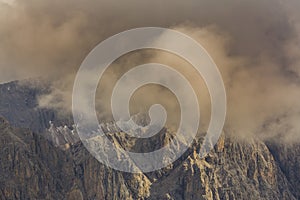 Dramatic scenery in the Dolomite Alps, Italy, in summer, with storm clouds and majestic peaks