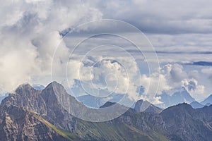 Dramatic scenery in the Dolomite Alps, Italy, in summer, with storm clouds and majestic peaks