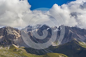 Dramatic scenery in the Dolomite Alps, Italy, in summer, with storm clouds and majestic peaks