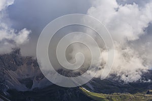 Dramatic scenery in the Dolomite Alps, Italy, in summer, with storm clouds and majestic peaks