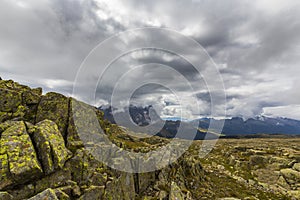 Dramatic scenery in the Dolomite Alps, Italy, in summer, with storm clouds and majestic peaks