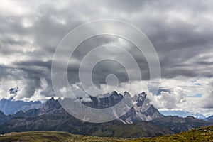 Dramatic scenery in the Dolomite Alps, Italy, in summer, with storm clouds and majestic peaks