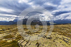 Dramatic scenery in the Dolomite Alps, Italy, in summer, with storm clouds and majestic peaks