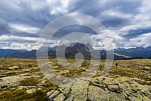 Dramatic scenery in the Dolomite Alps, Italy, in summer, with storm clouds and majestic peaks