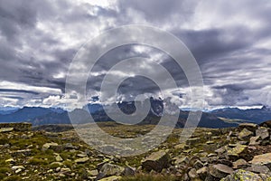 Dramatic scenery in the Dolomite Alps, Italy, in summer, with storm clouds and majestic peaks