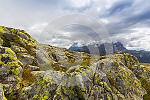 Dramatic scenery in the Dolomite Alps, Italy, in summer, with storm clouds and majestic peaks