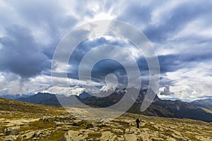 Dramatic scenery in the Dolomite Alps, Italy, in summer, with storm clouds and majestic peaks