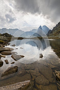 Dramatic scenery in the Dolomite Alps, Italy, in summer, with storm clouds and majestic peaks