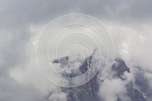 Dramatic scenery in the Dolomite Alps, Italy, in summer, with storm clouds and majestic peaks