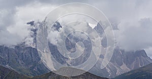 Dramatic scenery in the Dolomite Alps, Italy, in summer, with storm clouds and majestic peaks