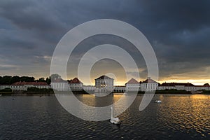 Dramatic scenery of post storm sunset of Nymphenburg palace in Munich Germany.