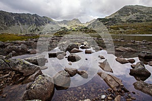 Dramatic scenery in the Romanian Alps, with stormy cloudscape