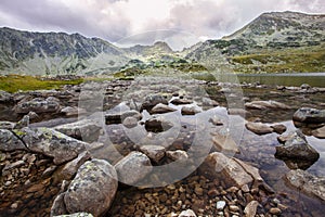 Dramatic scenery in the Romanian Alps, with stormy cloudscape