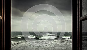 Dramatic sea view from opened window with big stormy waves and dramatic sky during rain and storm weather in fall season on sea co