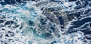 Dramatic sea waves storm from aerial view. Deep dark blue ocean water texture background. Top view. Fine art photography of stormy