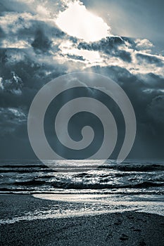 Dramatic seascape. Sea with waves and dark cloudy sky