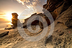 Dramatic seascape sunset with orange skies and reflections