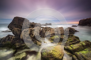 Dramatic seascape during sunset with slow shutter technique.