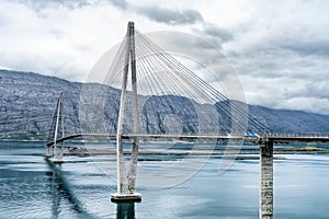 Dramatic sideview photo of Helgelandsbrua norwegian or Helgeland Bridge is Norway`s finest bridges between Alstahaug and photo