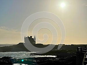 Dramatic Silhouette of ChÃÂ¢teau Turpault at Sunrise, Quiberon Peninsula, Morbihan, Under a Radiant Sky photo