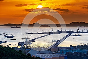 Dramatic Sky burst over Sriracha harbor port Chonburi Thailand, long exposure technic