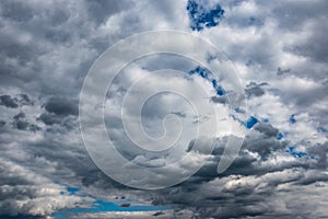 Dramatic sky clouds against sun. dramatic sky with blue, gray and white clouds. dramatic storm cloud sky