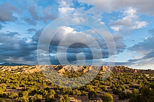 Dramatic sky and clouds over the desert landscape along the pilgrimage route to Chimayo, New Mexico