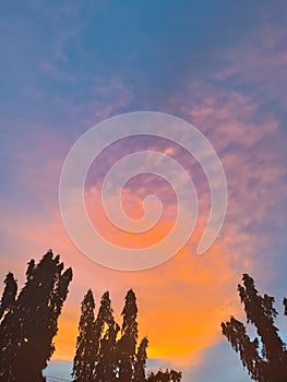 Dramatic sky with clouds and silhouette tree