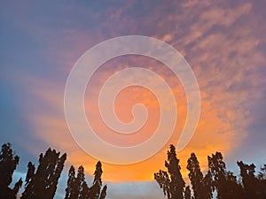 Dramatic sky with clouds and silhouette tree