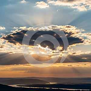 A dramatic sky with a large dark cloud partially blocking the sun