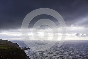 Dramatic sky over Atlantic Ocean coast near Sao Miguel Island, Azores, Portugal