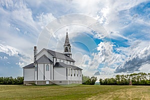 A dramatic sky over the back of the Blumenfeld Roman Catholic Church