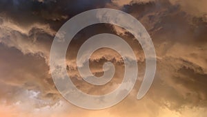 Dramatic sky with storm clouds swirling at sunset