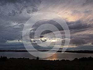 Dramatic sky before storm over lake